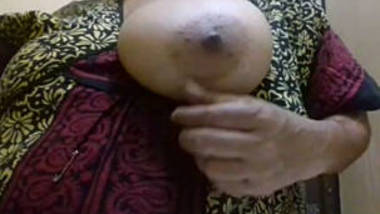 Desi mom self records her boob press for her bf..son gets this video from her mobile
